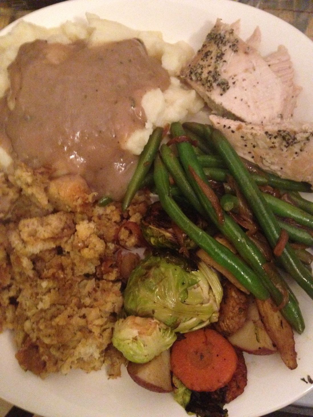Turkey, Mashed Potatoes, Green Beans, Stuffing, Root Veggies, and Cannolis for dessert (not shown, because they immediately went into my tummy! nom nom) haha  All courtesy of Whole Foods catering ;) - Ana Milteer